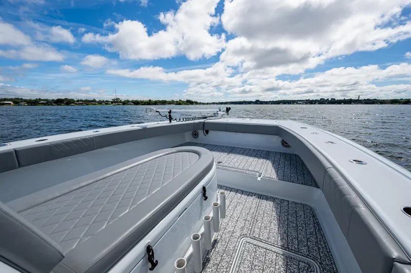  Yacht Photos Pics 2022 Freeman 34VH boat interior with cushioned seating, on a sunny day at sea.