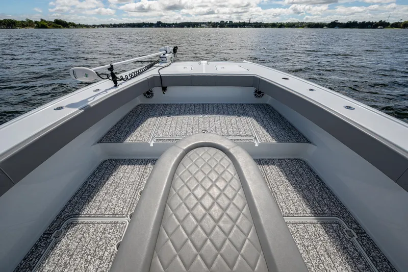  Yacht Photos Pics Bow view of 2022 Freeman 34VH boat with textured flooring on open water.