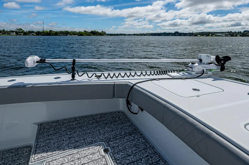  Yacht Photos Pics 2022 Freeman 34VH boat with trolling motor on calm water under blue sky.
