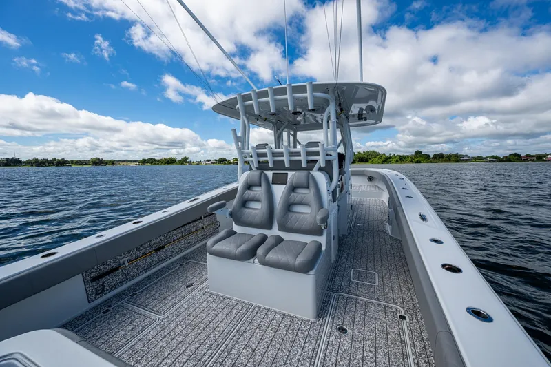  Yacht Photos Pics 2022 Freeman 34VH boat on water, featuring sleek design and comfortable seating.