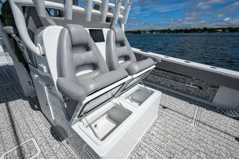  Yacht Photos Pics 2022 Freeman 34VH boat with open storage compartments and luxurious seating on deck.