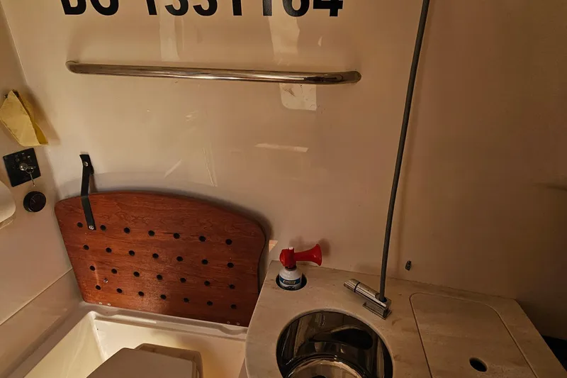  Yacht Photos Pics Interior of 2022 Grady-White Canyon 306 boat, featuring sink and storage area.