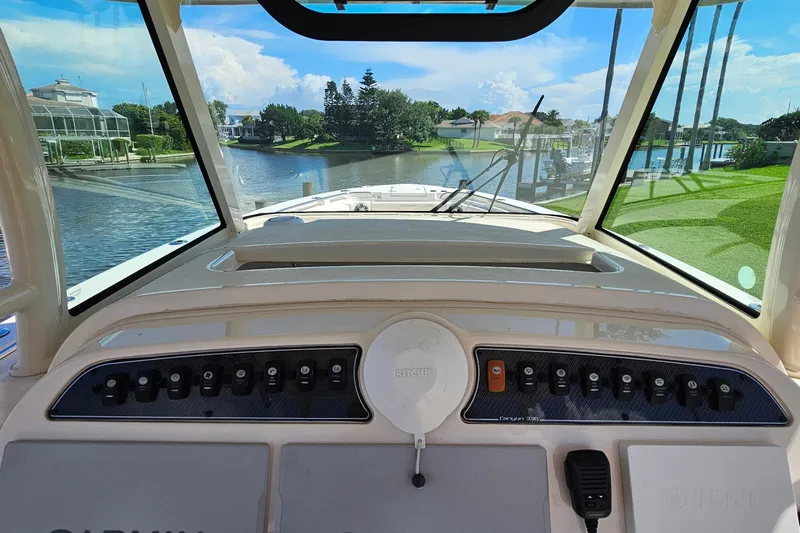  Yacht Photos Pics 2022 Grady-White Canyon 306 boat dashboard with waterway view.