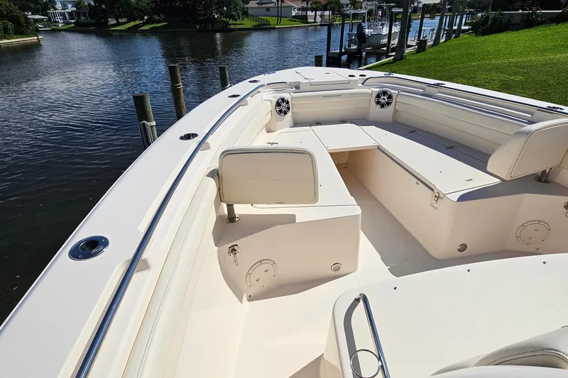  Yacht Photos Pics 2022 Grady-White Canyon 306 boat interior, featuring spacious seating and sleek design.