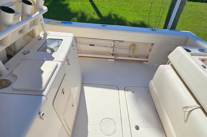  Yacht Photos Pics 2022 Grady-White Canyon 306 boat interior with storage and seating.