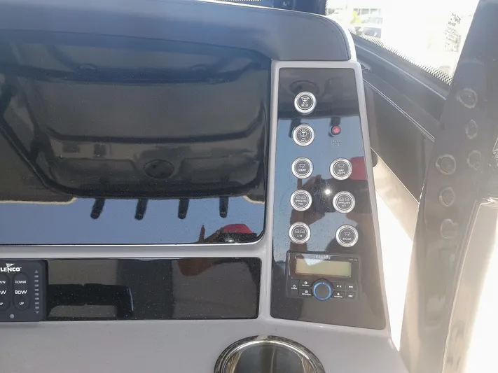  Yacht Photos Pics 2024 Robalo R250 Center Console dashboard with control panel and buttons.