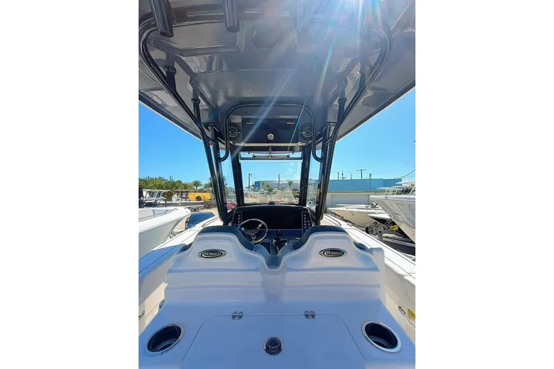  Yacht Photos Pics 2024 Robalo R250 Center Console boat interior with steering wheel and console view.
