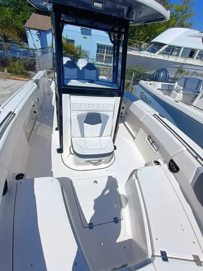  Yacht Photos Pics 2024 Robalo R250 Center Console boat interior with seating and console view.