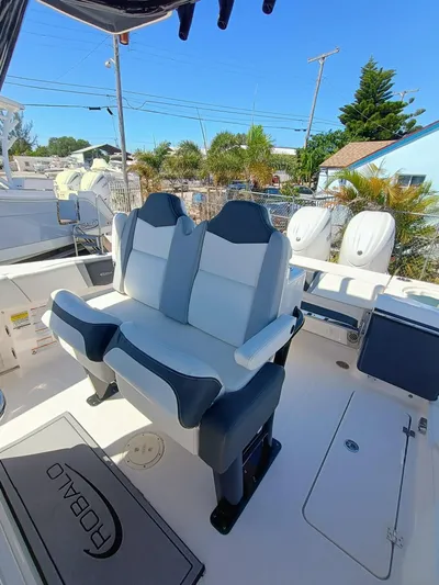  Yacht Photos Pics 2024 Robalo R250 Center Console boat interior with dual seating and outboard motors.