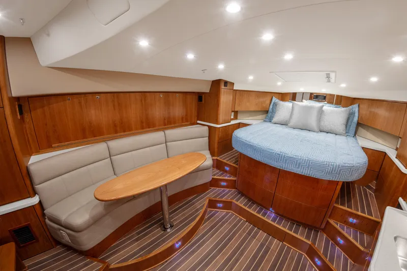  Yacht Photos Pics Luxurious interior of 2025 Albemarle 36 Express yacht with cozy seating and elegant wood finishes.