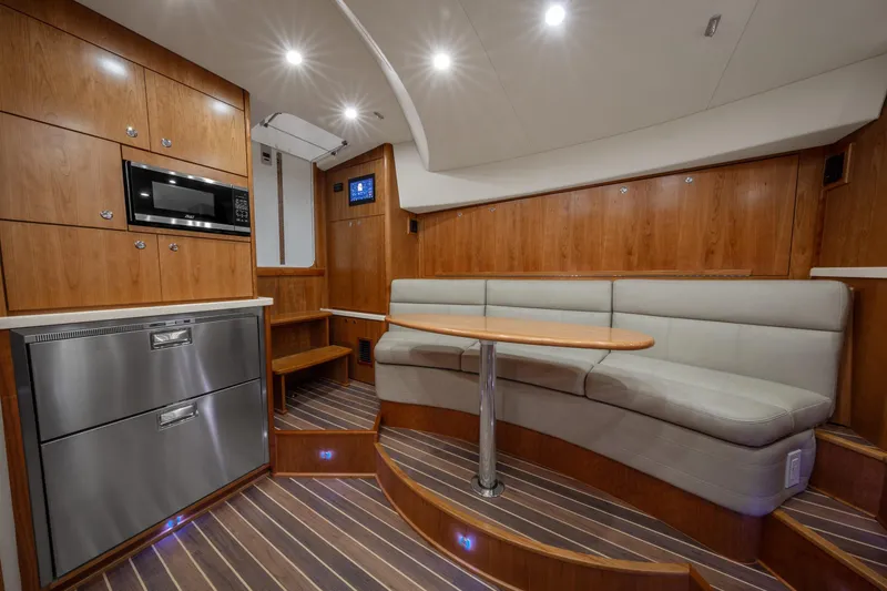  Yacht Photos Pics 2025 Albemarle 36 Express yacht interior with modern kitchen and cozy seating area.