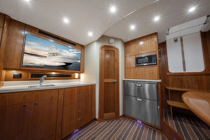 Yacht Photos Pics Interior of 2025 Albemarle 36 Express yacht with modern kitchen and wood finishes.