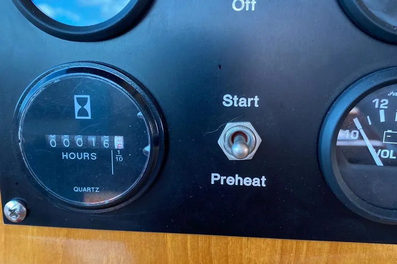 Contessa Yacht Photos Pics Dashboard of 2001 Grand Banks 49 Eastbay SX with hour meter and start switch.