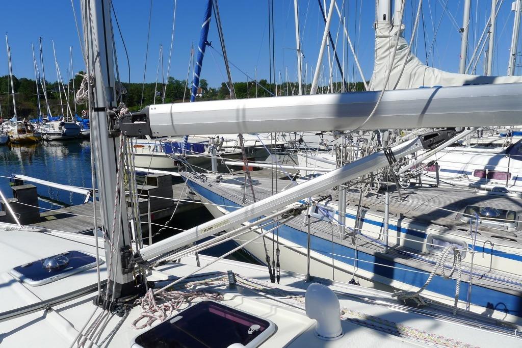 Sailboat deck with rigging and masts, Scanner 391 model, 2006, docked at marina.