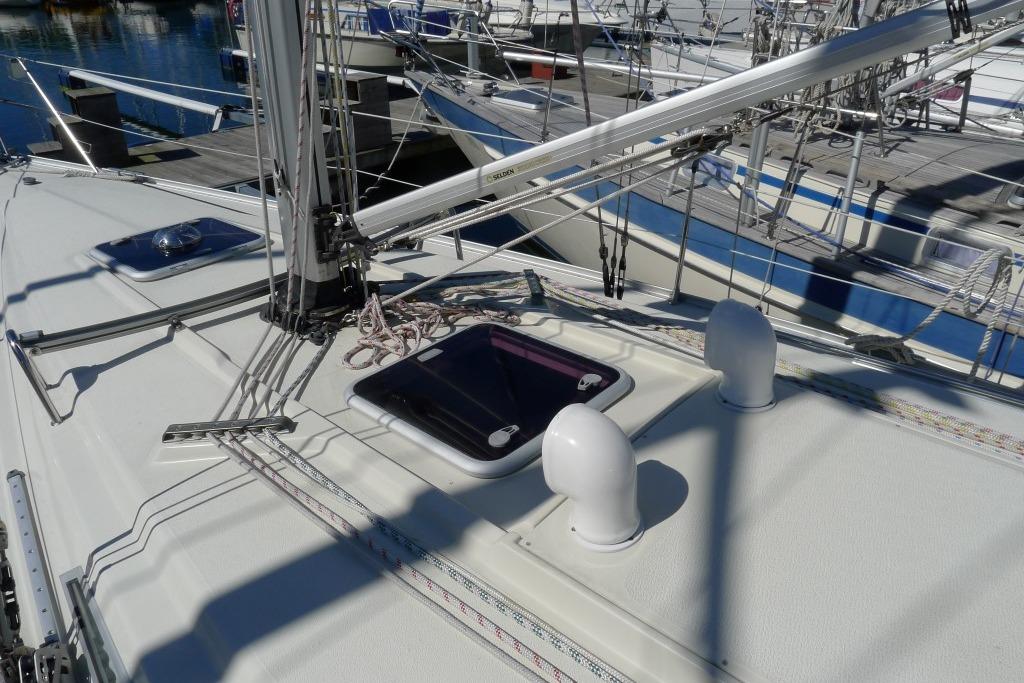 Sailboat deck with rigging and hatch, Scanner 391 model, docked at marina, 2006.