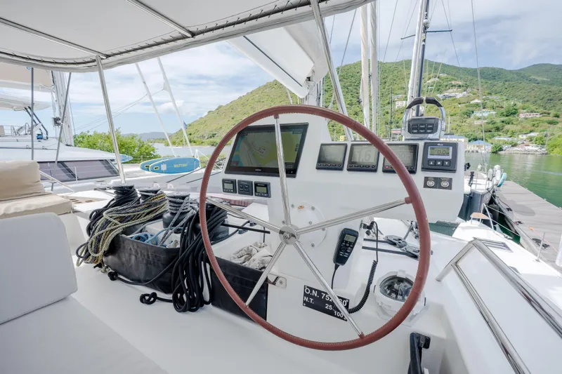  Yacht Photos Pics Cockpit of 2019 Fountaine Pajot Ipanema 58 catamaran with navigation instruments and steering wheel.