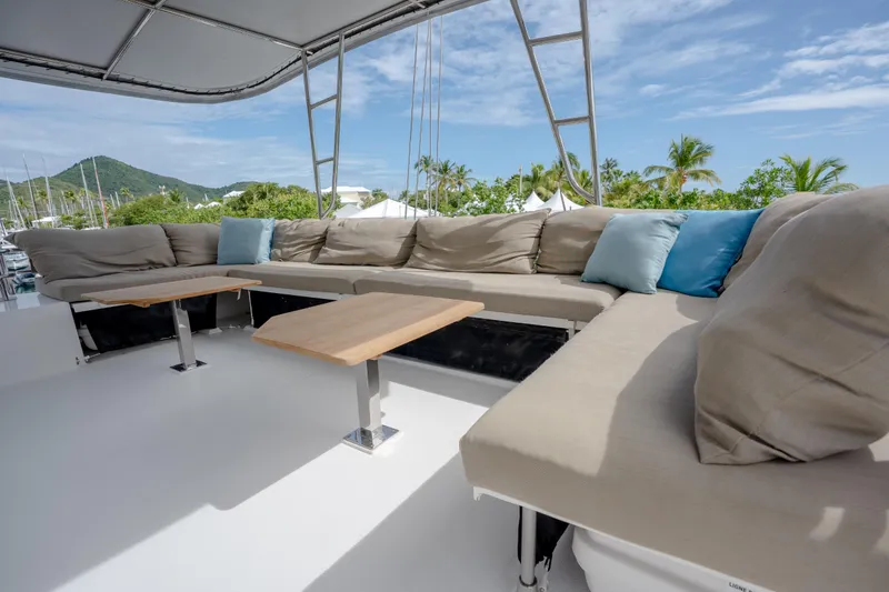  Yacht Photos Pics Spacious outdoor seating on 2019 Fountaine Pajot Ipanema 58 catamaran with scenic views.