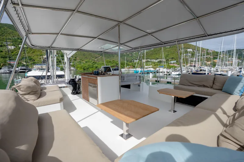  Yacht Photos Pics Spacious deck of 2019 Fountaine Pajot Ipanema 58 catamaran with comfortable seating and scenic marina view.