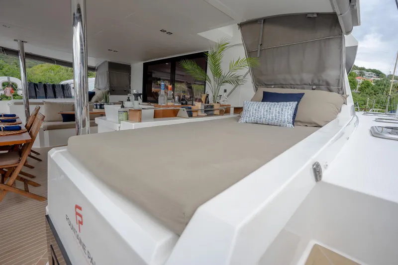  Yacht Photos Pics Luxurious 2019 Fountaine Pajot Ipanema 58 yacht interior with elegant seating and dining area.