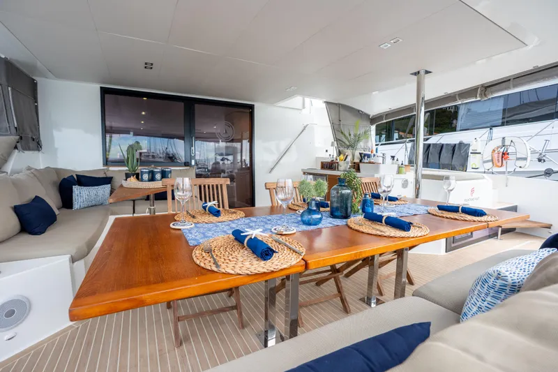  Yacht Photos Pics Luxurious 2019 Fountaine Pajot Ipanema 58 yacht interior with elegant dining setup.