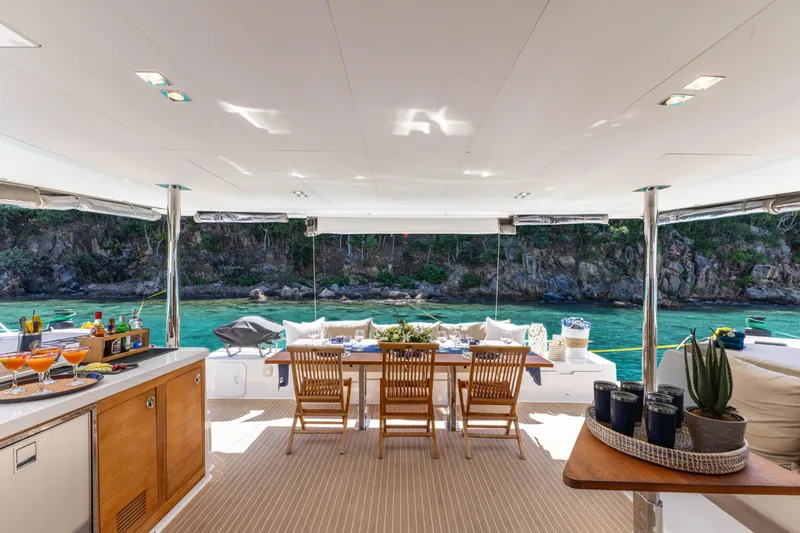  Yacht Photos Pics Luxurious 2019 Fountaine Pajot Ipanema 58 yacht with elegant outdoor dining area.