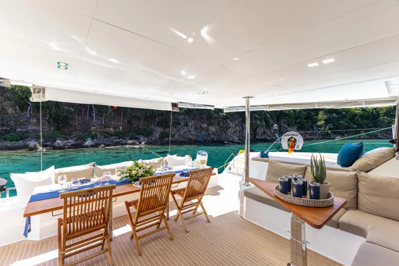  Yacht Photos Pics Luxurious 2019 Fountaine Pajot Ipanema 58 yacht with elegant outdoor dining area.