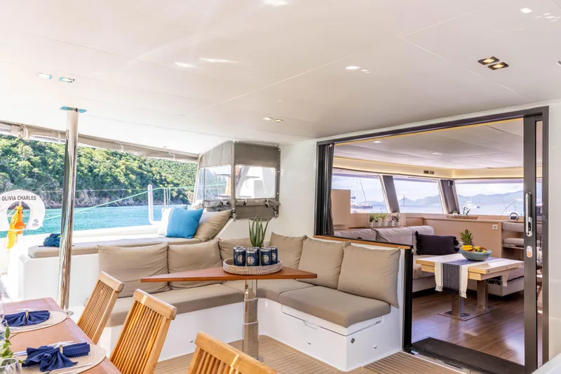  Yacht Photos Pics Luxurious 2019 Fountaine Pajot Ipanema 58 yacht interior with elegant seating and ocean view.