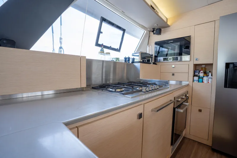  Yacht Photos Pics Modern kitchen in 2019 Fountaine Pajot Ipanema 58 yacht with sleek appliances and ample storage.
