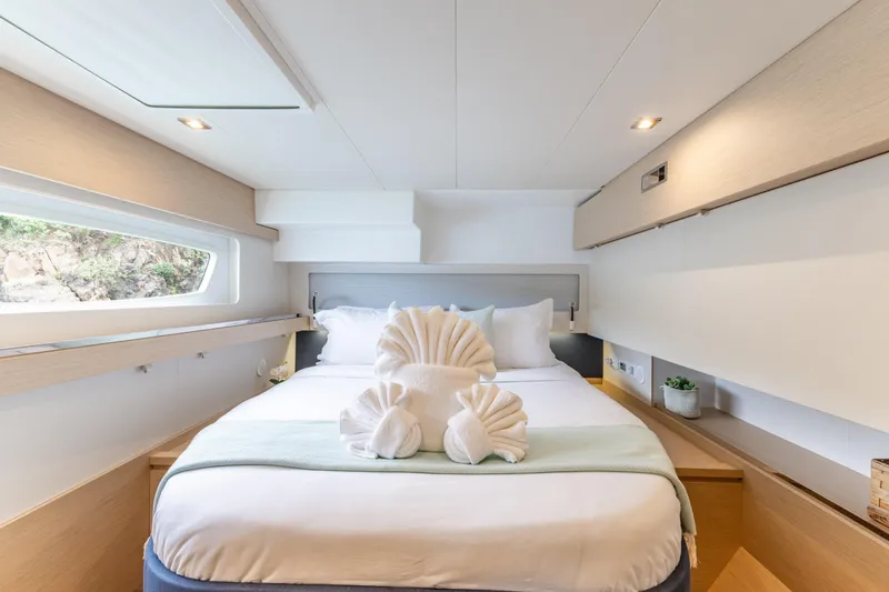  Yacht Photos Pics Luxurious cabin interior of 2019 Fountaine Pajot Ipanema 58 yacht with elegant bedding.