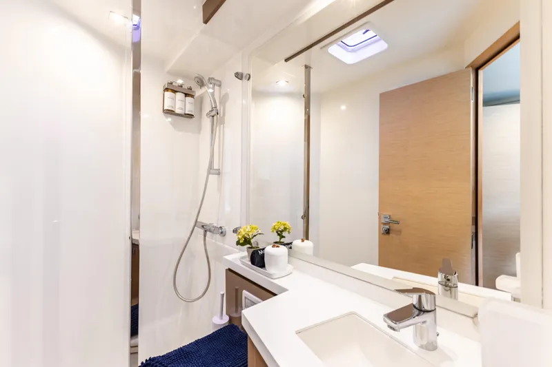  Yacht Photos Pics Luxurious bathroom in 2019 Fountaine Pajot Ipanema 58 yacht, featuring modern fixtures and elegant design.