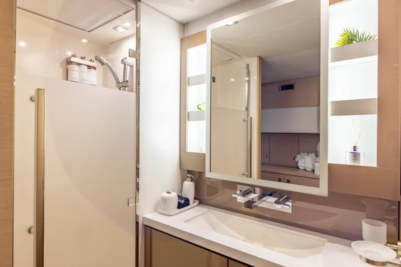  Yacht Photos Pics Luxurious bathroom in 2019 Fountaine Pajot Ipanema 58 yacht, featuring modern fixtures and elegant design.