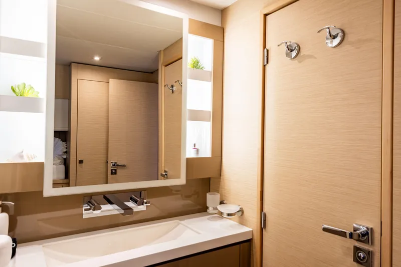  Yacht Photos Pics Luxurious bathroom interior of 2019 Fountaine Pajot Ipanema 58 yacht, featuring modern fixtures.