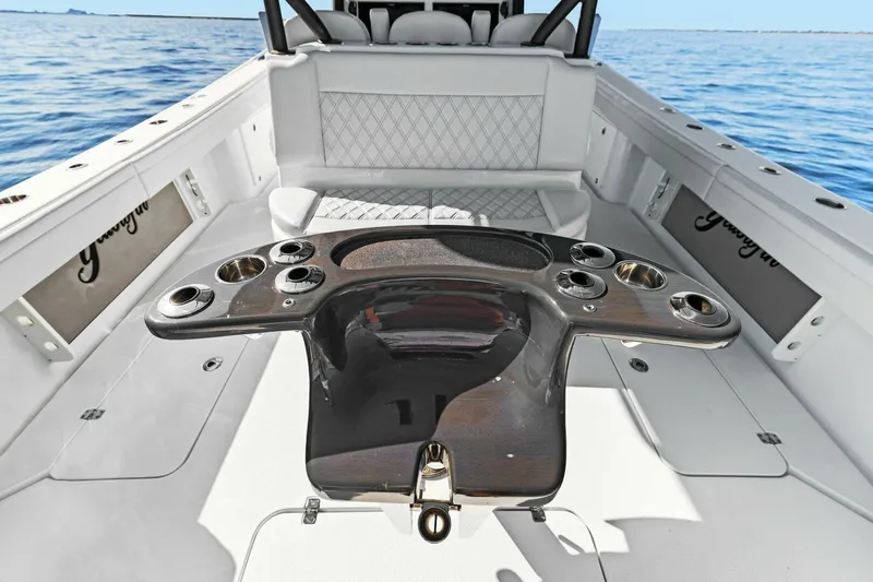 Rumble Fish Yacht Photos Pics 2021 Yellowfin 39 boat interior with fishing rod holders and seating, on open water.