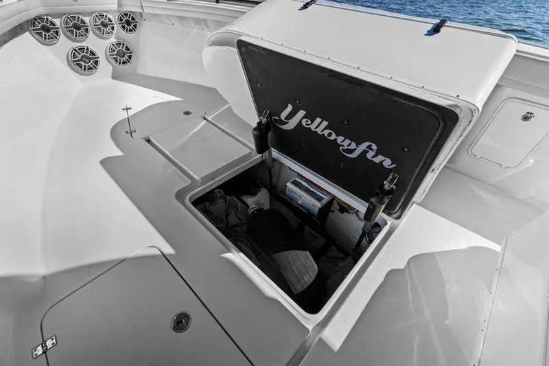 Rumble Fish Yacht Photos Pics 2021 Yellowfin 39 boat storage compartment open, showcasing interior space and design.