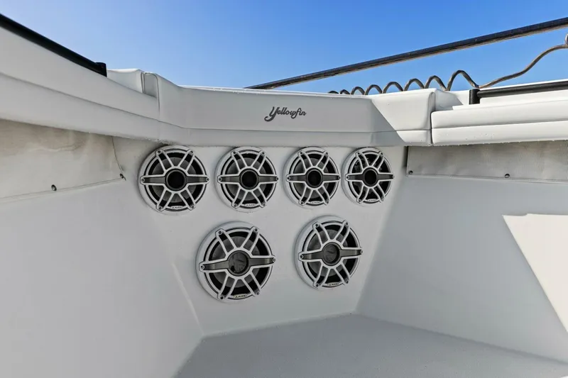 Rumble Fish Yacht Photos Pics 2021 Yellowfin 39 boat speakers, white interior, clear blue sky background.