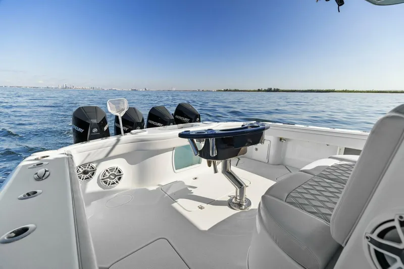 Rumble Fish Yacht Photos Pics 2021 Yellowfin 39 boat interior with ocean view, featuring multiple outboard motors.