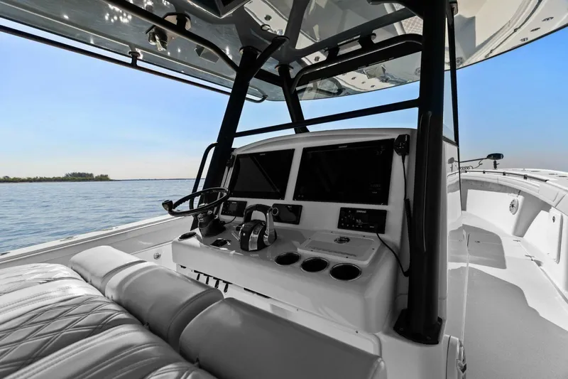 Rumble Fish Yacht Photos Pics 2021 Yellowfin 39 boat cockpit with modern controls and ocean view.