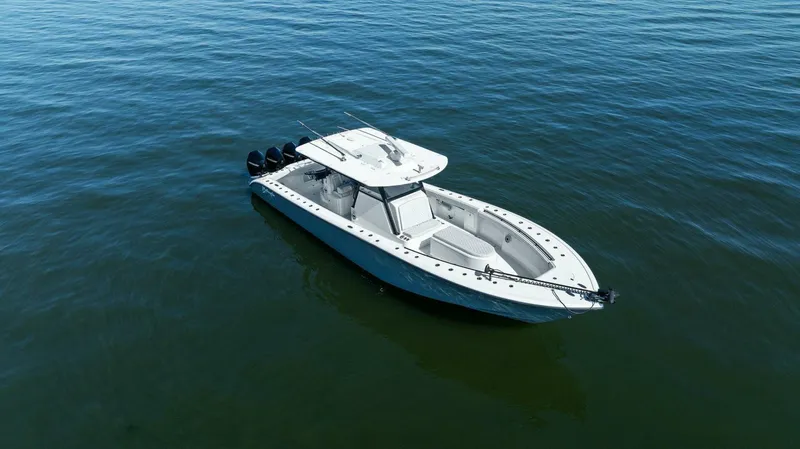 Rumble Fish Yacht Photos Pics 2021 Yellowfin 39 boat on calm water, aerial view.