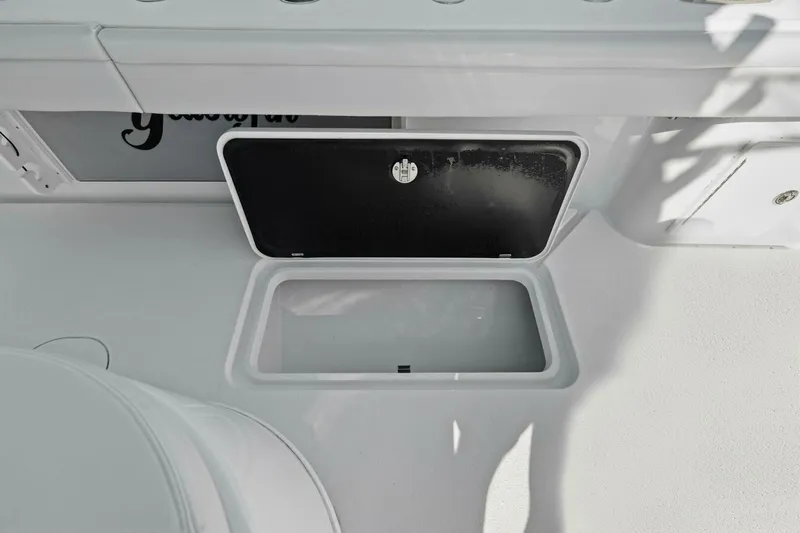 Rumble Fish Yacht Photos Pics 2021 Yellowfin 39 boat storage compartment with open hatch, showcasing interior space.