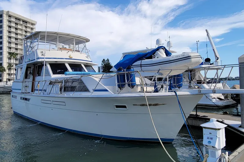 'charisma' Yacht Photos Pics 1985 Chris-Craft 500 Constellation yacht docked at marina, clear sky background.