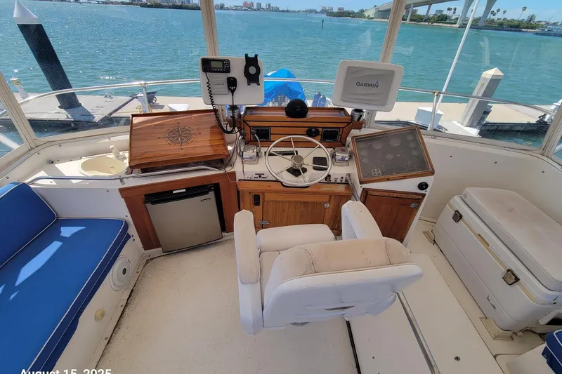 'charisma' Yacht Photos Pics Helm of 1985 Chris-Craft 500 Constellation yacht with navigation equipment and seating.