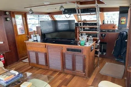 'charisma' Yacht Photos Pics 1985 Chris-Craft 500 Constellation yacht interior with wooden decor and modern amenities.