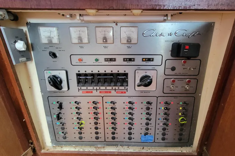 'charisma' Yacht Photos Pics Control panel of a 1985 Chris-Craft 500 Constellation yacht with various switches and gauges.