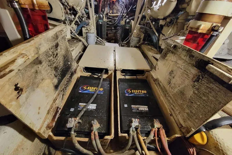 'charisma' Yacht Photos Pics 1985 Chris-Craft 500 Constellation engine room with Electro batteries and wiring.