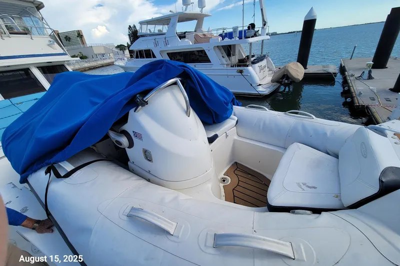 'charisma' Yacht Photos Pics 1985 Chris-Craft 500 Constellation yacht docked, with inflatable boat and blue cover, August 15, 2025.