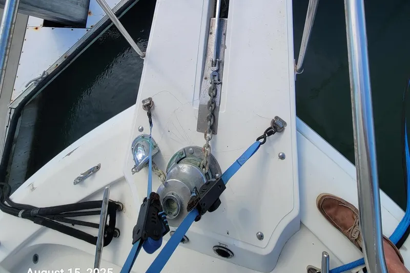 'charisma' Yacht Photos Pics 1985 Chris-Craft 500 Constellation boat deck with anchor chain and winch system.