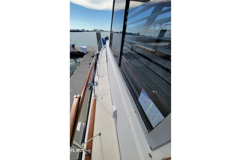 'charisma' Yacht Photos Pics 1985 Chris-Craft 500 Constellation yacht docked, showcasing sleek deck and waterfront view.