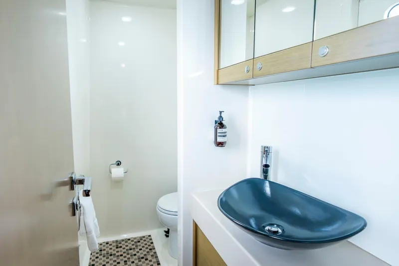 Texas T Yacht Photos Pics Luxurious bathroom on 2009 Custom Sulis Marine Expedition Yacht with modern sink and fixtures.