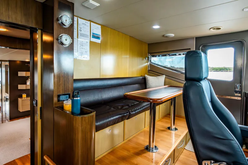 Texas T Yacht Photos Pics Luxurious interior of 2009 Sulis Marine Expedition Yacht with leather seating and wooden accents.