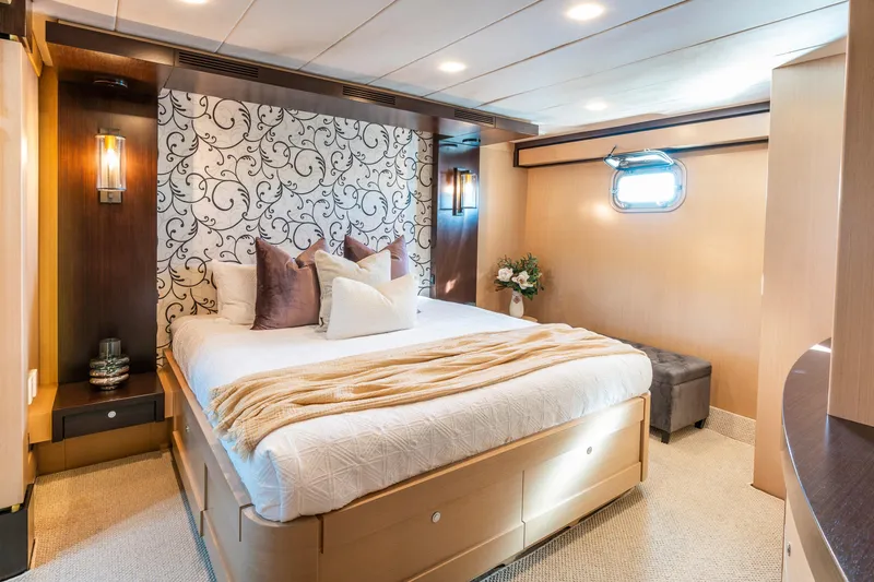 Texas T Yacht Photos Pics Luxurious bedroom on 2009 Custom Sulis Marine Expedition Yacht with elegant decor and cozy bedding.